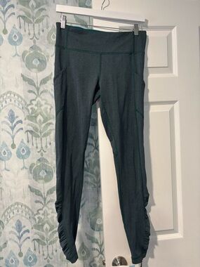 Lululemon Herringbone Green Leggings with purple detail